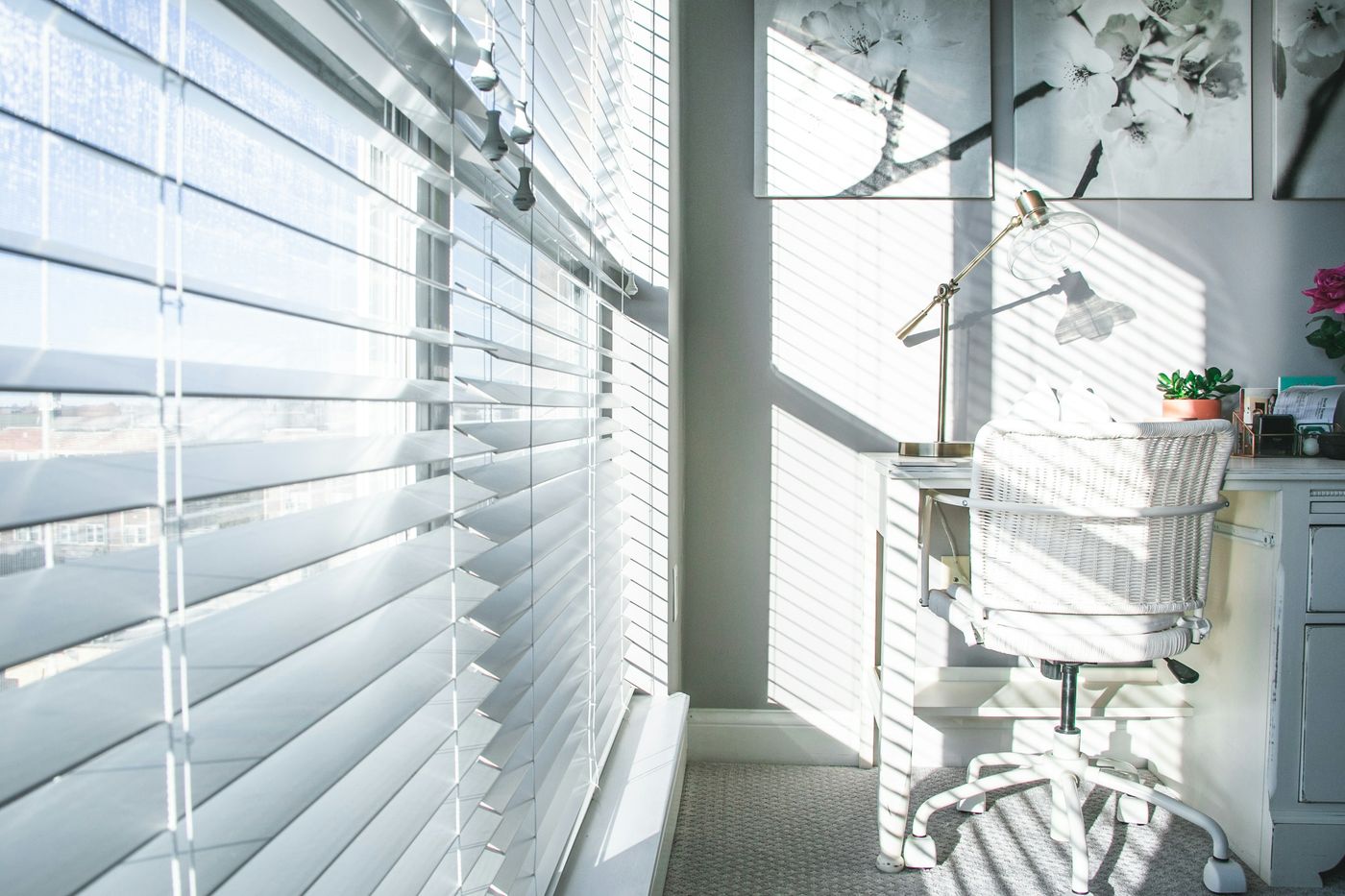 Clean white blinds in a sunny home office